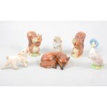 Collection of twelve Beswick Beatrix Potter models, two Beswick animals, and a Goebel pig.