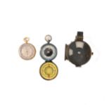 Brass pocket barometer, a Woods military gun sight, and a pocket compass.