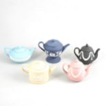 Seven assorted Wedgwood Jasperware teapots.