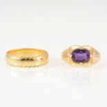Two gold rings, an oval mixed cut amethyst four claw set into a yellow metal dress ring mount,