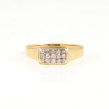A modern diamond cluster ring, fifteen small diamonds pave set in three rows as a rectangular