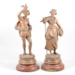 After Rancoulet, a pair of patinated spelter figures, 'Fauconnier' and 'Faneuse'
