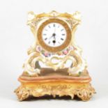 French porcelain mantel clock, white enamel dial, replaced movement, on a gilt composition plinth.