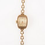 Rotary - a lady's 9 carat yellow gold bracelet watch, rectangular light champagne baton dial with