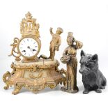 A figural gilt spelter mantel clock, (af), cast metal Scotty dog and a figure of a Japanese Geisha,