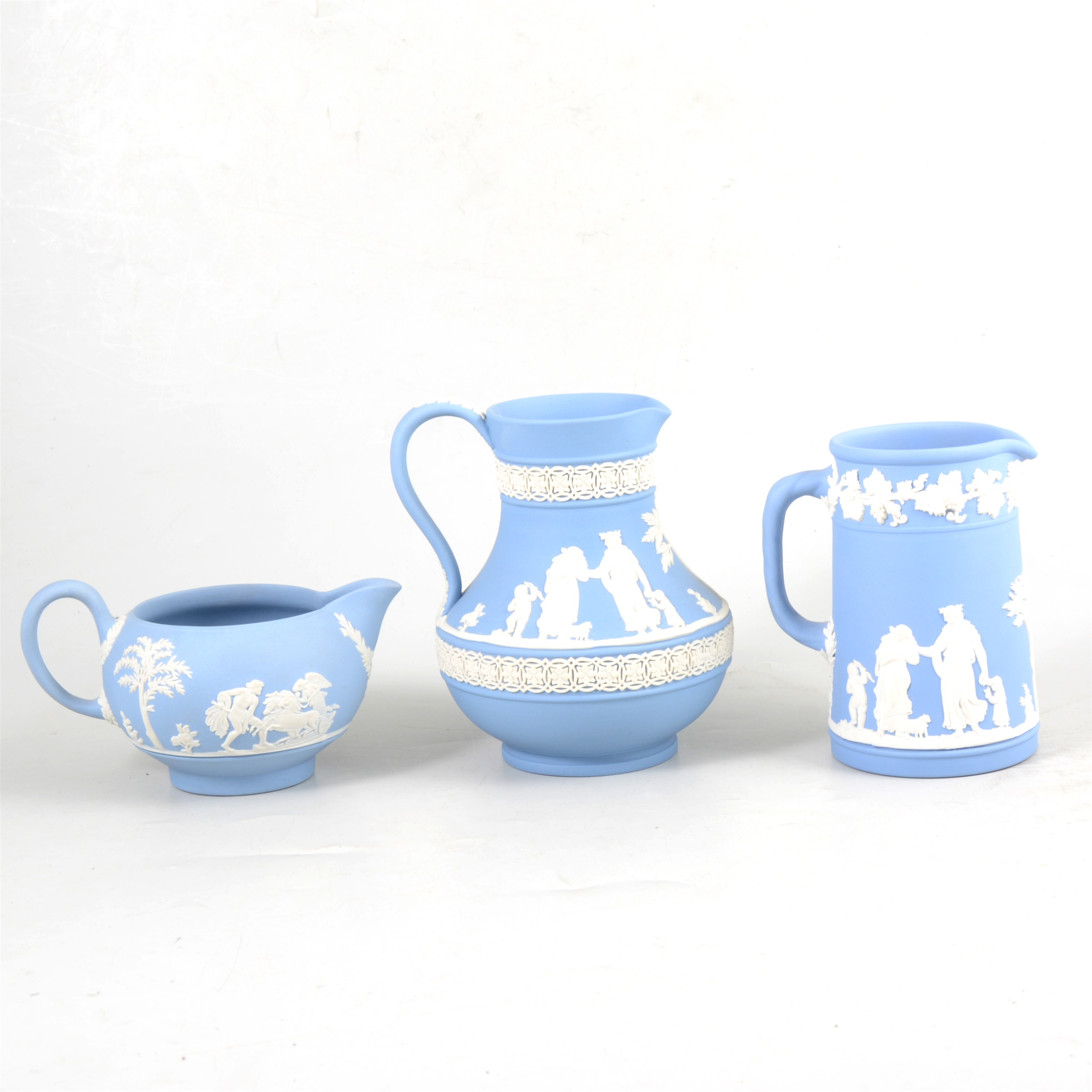 Three Wedgwood blue Jasperware jugs