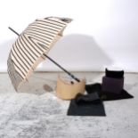 Jean Paul Gaultier - A cream umbrella with black braiding, a 12mm wide un-marked black leather belt