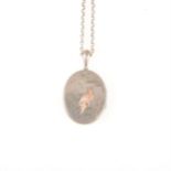 A silver coloured oval locket 46mm x 37mm with applied rose metal bird, silver coloured belcher