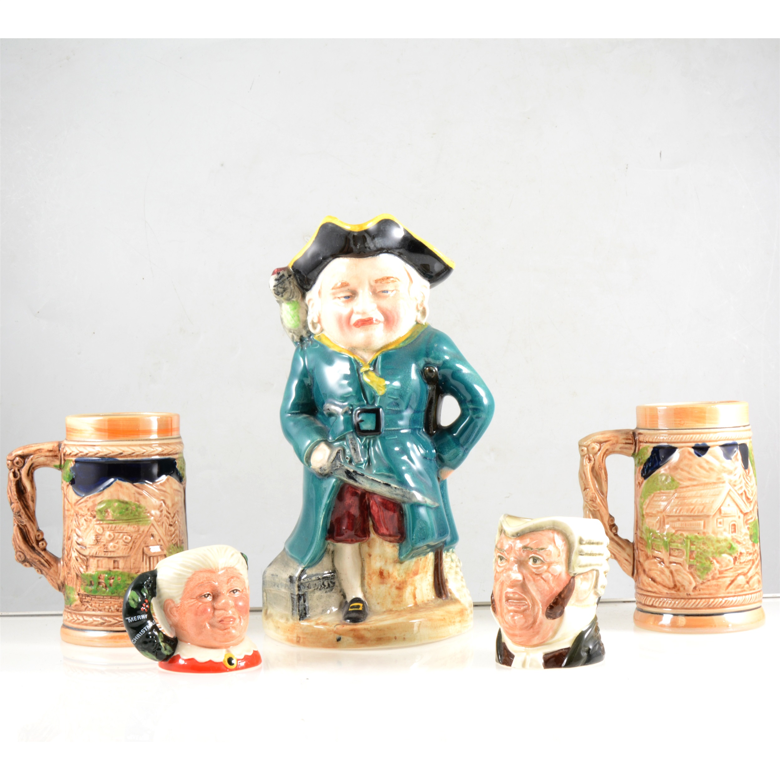 A collection of Toby jugs and beer steins.