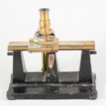 W G Pye & Co, Cambridge, an iron and brass travelling microscope, 19.5cm.