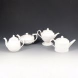 Four Wedgwood white jasper teapot form candleholders.