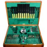 A Walker & Hall silver-plated canteen of cutlery in oak case on stand.