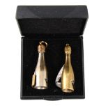 Two novelty cigarette cutters in the form of champagne bottles