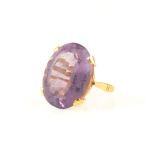 A large amethyst dress ring, the oval step cut stone 22mm x 15mm x 9.5mm, approximate carat weight