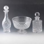 A quantity of cut crystal glassware, including decanters and fruit bowls.