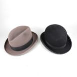 A vintage black bowler hat and a taupe trilby.