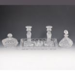 Moulded clear glass 8-piece dressing table set.