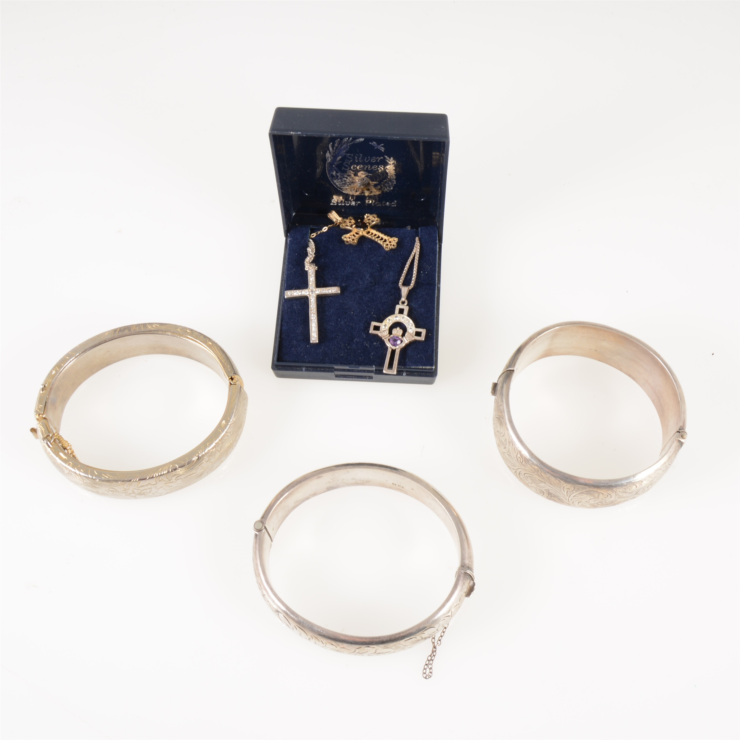 Two silver hollow half hinged bangles 16mm, 23mm, a metal bangle, two pairs of gilt metal cufflinks,