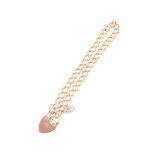 A 9 carat rose gold solid curb link bracelet, 5.2mm wide, fitted with a padlock fastener,