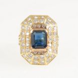 A large sapphire and diamond rectangular cluster ring, a rectangular step cut sapphire 9.7mm x