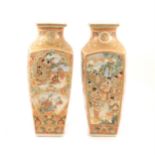 A pair of Japanese satsuma vases with panels depicting warriors, a family, and flowers, 30cm.