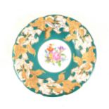 A Meissen hand painted dish with floral centre, turquoise green border with gilded acanthus leaf