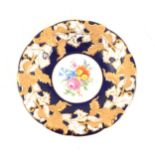 A Meissen hand painted dish with floral centre, cobalt blue border with gilded acanthus leaf