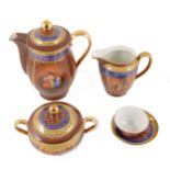 A Slovakia coffee service in the "Rembrandt" design, burgundy ground with borders of blue and gilt,