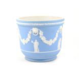 A Wedgwood pale blue and white jasper ware jardiniere, 16cm high, 18.5cm diameter.