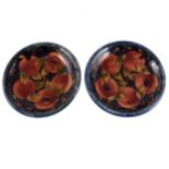 A pair of William Moorcroft plates, 'Pomegranate' design, circa 1920