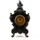 American Rococo revival style black painted mantel clock, ...