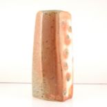 Lisa Hammond, a stoneware faceted vase with soda glaze.
