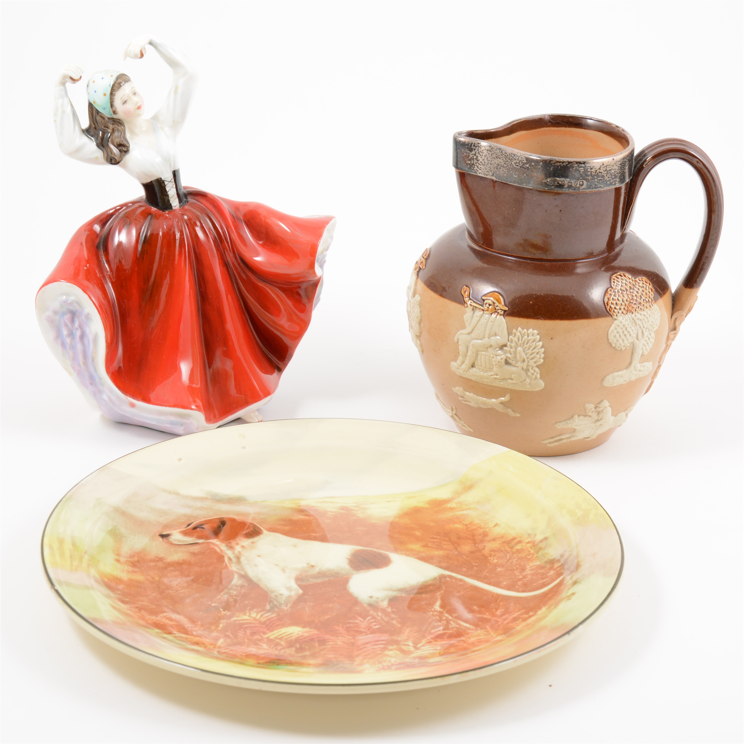 Royal Doulton stoneware jug, with a silver rim; three Royal Doulton Series Ware wall plates.;