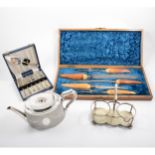 A collection of silver-plated wares, including cased cutlery, bread basket, Britannia metal teapots,