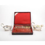 A tray of silver-plated flatware including a cased set of twelve Christofle table forks and table