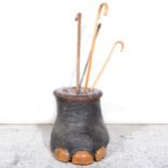 Elephant's foot stick stand, oak mounted, with four walking sticks