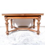 A suite of German carved oak dining room furniture