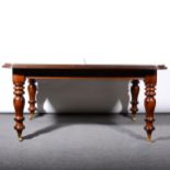 A Victorian mahogany extending dining table