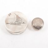 A white metal patch box with mirror depicting a niello sailing junk, 50mm, and another 25mm pill