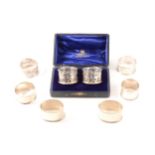 Fifteen silver napkin rings including a cased pair, various dates and makers including Chester,