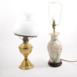 A brass oil lamp and a pottery base table lamp