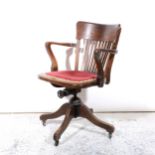 An oak office swivel chair, early 20th century