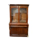 A Victorian mahogany bookcase, substantial damage