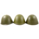 Three Russian army steel helmets.