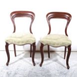 A pair of Victorian mahogany hoop back dining chairs