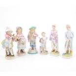 Pair of German porcelain figures of child musicians, and twelve others.