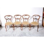 Set of six Victorian rosewood hoop-back dining chairs.