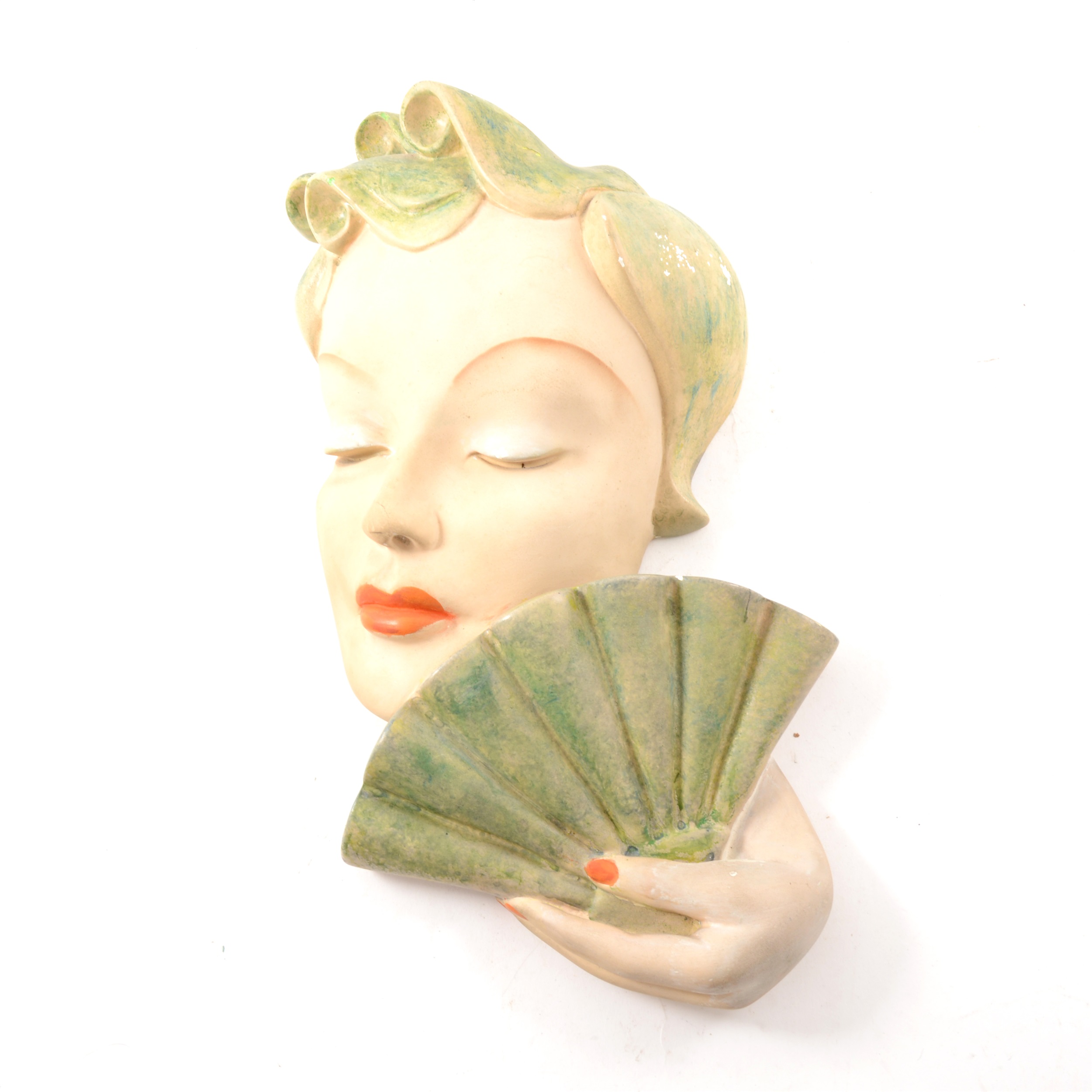 An Art Deco figural wall mask by Leonardi