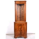 Reproduction mahogany freestanding corner cupboard,