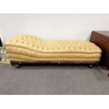 Empire inspired oak framed chaise longue, upholstered in buttoned tan-coloured leather, length